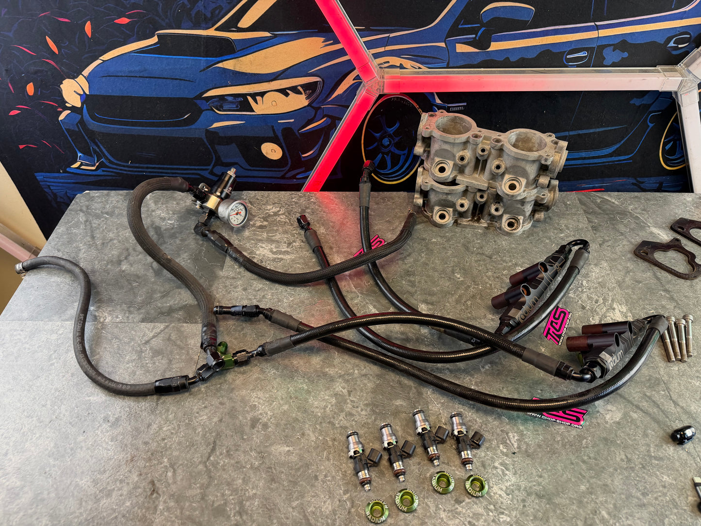 Under hood fueling kit w/ ID 1050 injectors , TGV deletes, radium fuel rails, fuel pulse dampers & areomotive fuel pressure regulator