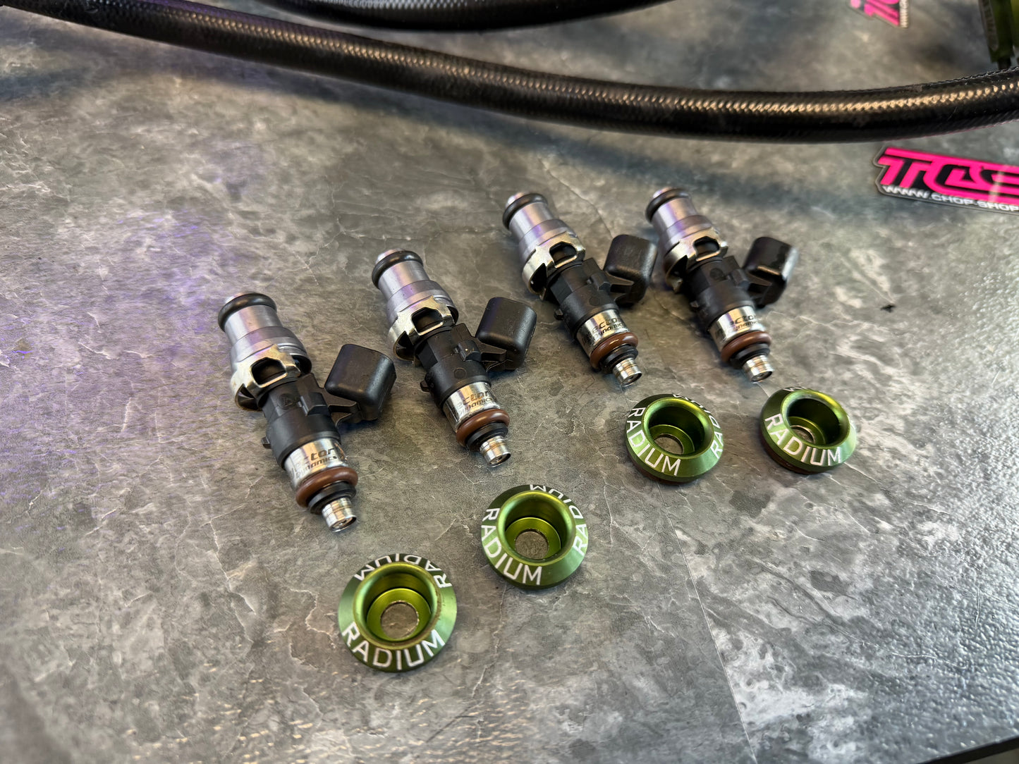 Under hood fueling kit w/ ID 1050 injectors , TGV deletes, radium fuel rails, fuel pulse dampers & areomotive fuel pressure regulator