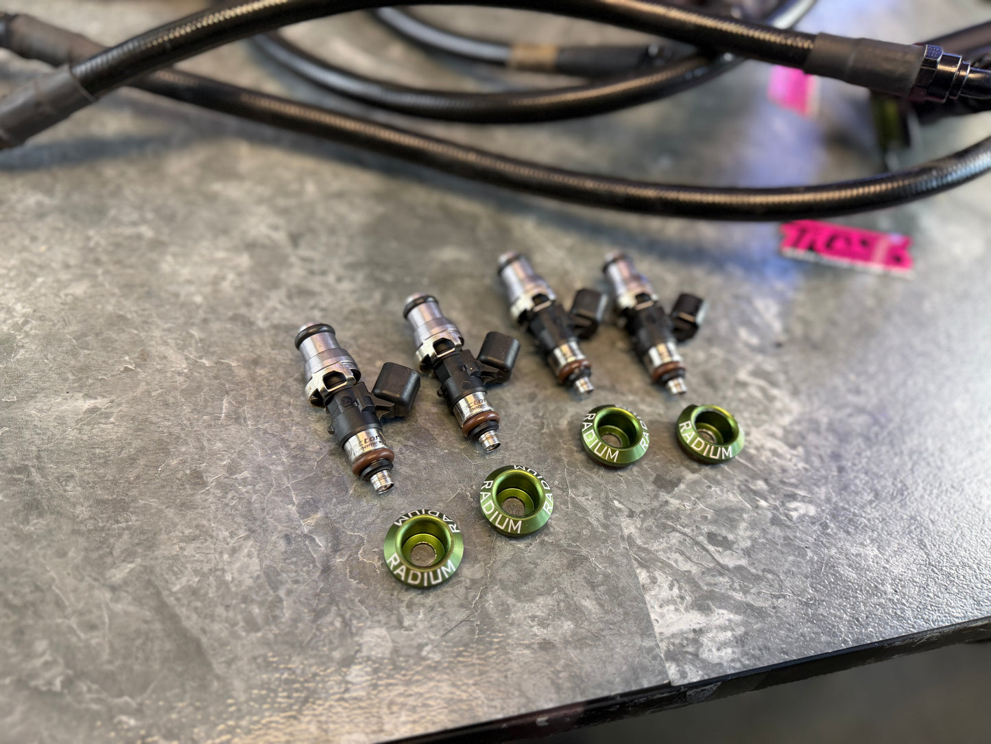 Under hood fueling kit w/ ID 1050 injectors , TGV deletes, radium fuel rails, fuel pulse dampers & areomotive fuel pressure regulator