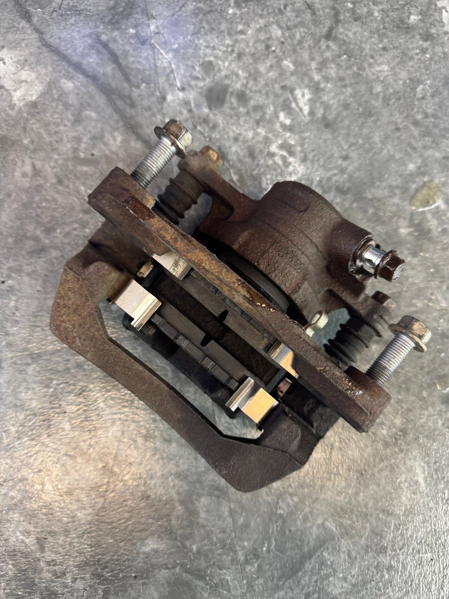 2008-2014 Subaru WRX OEM Rear Left Drivers Rear Brake Caliper Assembly Bracket