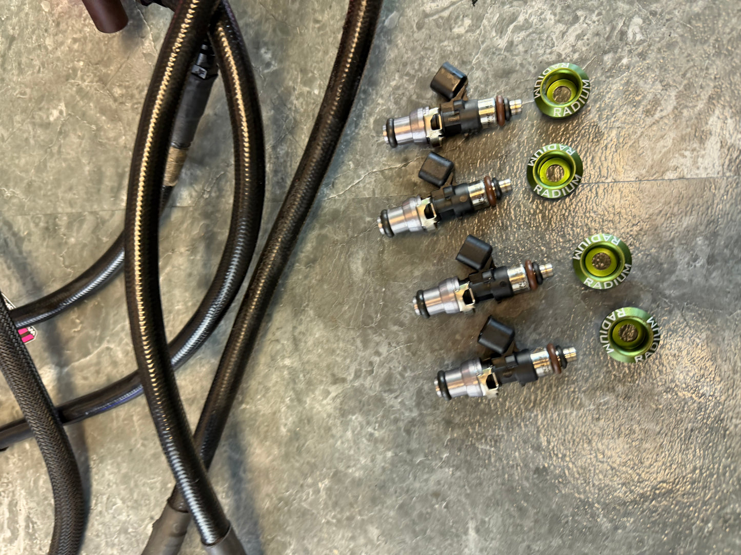 Under hood fueling kit w/ ID 1050 injectors , TGV deletes, radium fuel rails, fuel pulse dampers & areomotive fuel pressure regulator